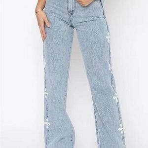 White Fox Boutique Light Blue Flare Jeans with White Cross Accents. Never Worn